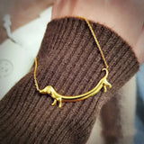 Zlatý náhrdelník s jazvečíkom