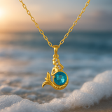 Zlatý náhrdelník s motívom morskej panny a modrým krištáľom